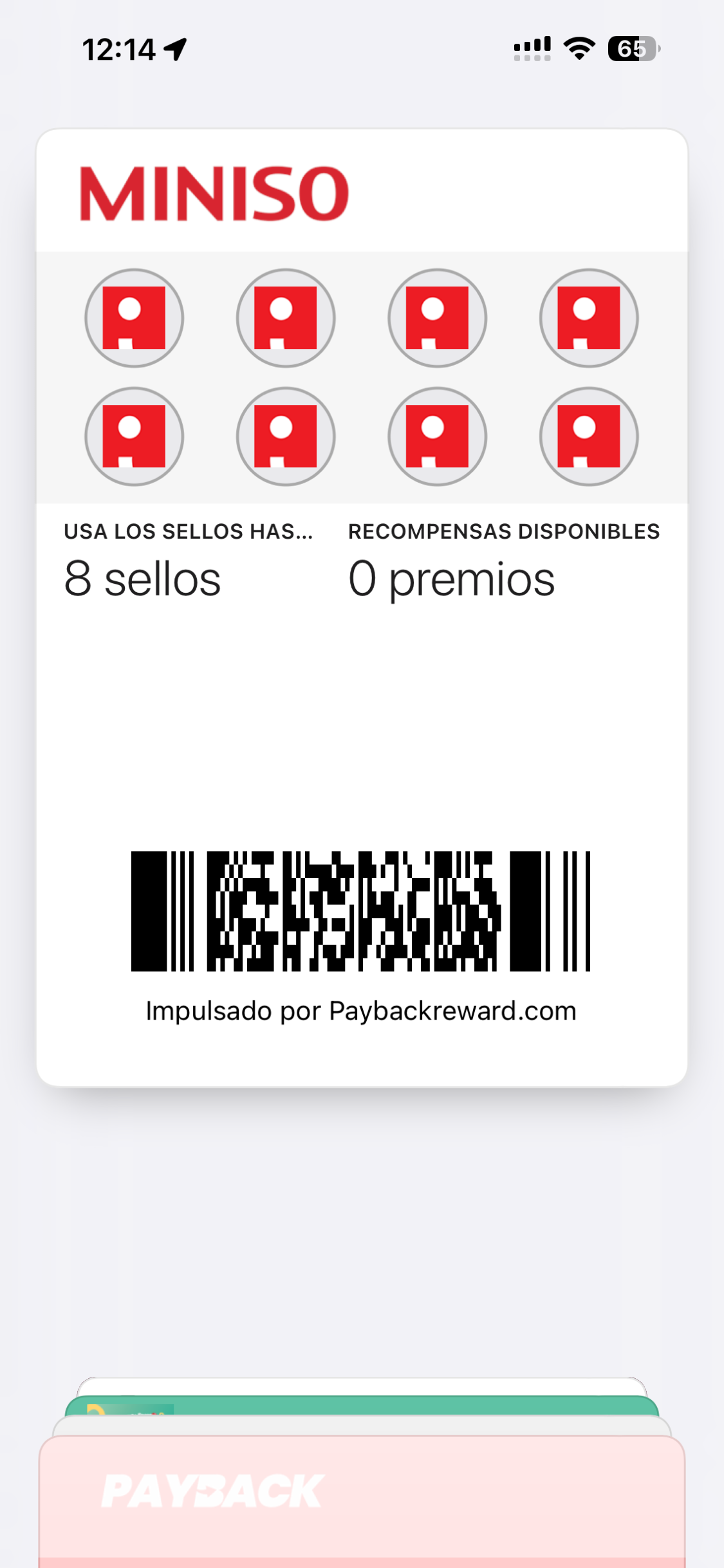 Tarjeta MINISO de Payback guardada en Wallet con ocho sellos, métricas y código digital